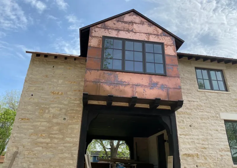 Copper metal panel facade on a stone building for Skylight Installation in Mineral Wells