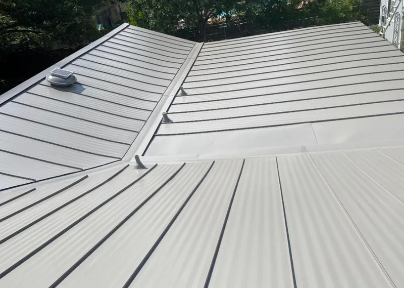 Solar attic fan installed on a metal roof for Roof Ventilation in Mineral Wells